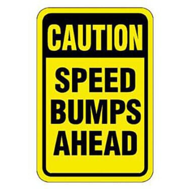 Caution Speed Bumps Ahead Sign