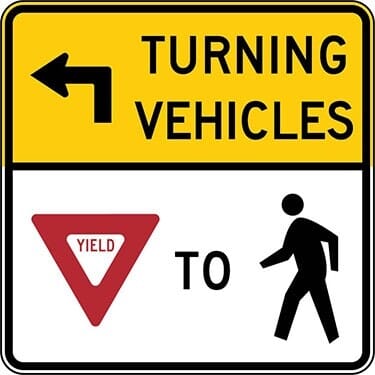 Turning Traffic Must Yield to Pedestrians with Left Arrow Sign