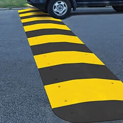 Car going over speed hump.